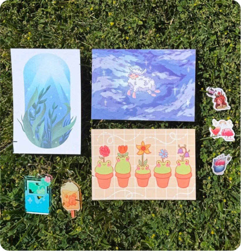 Prints and cards laid out on grass