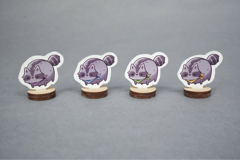 Four raccoon game pieces in a row