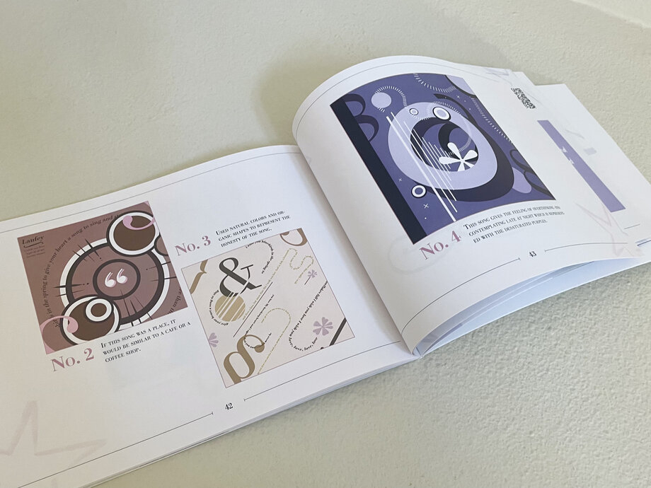 Open songbook showing a purple spiral cover design