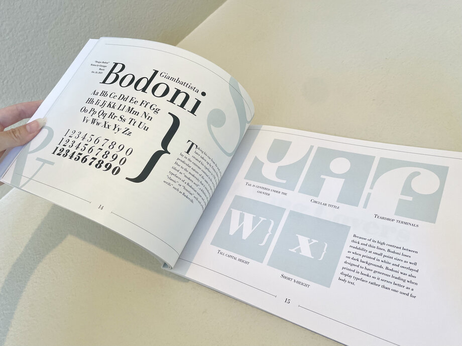 Open songbook showing the Bodoni type specimen spread