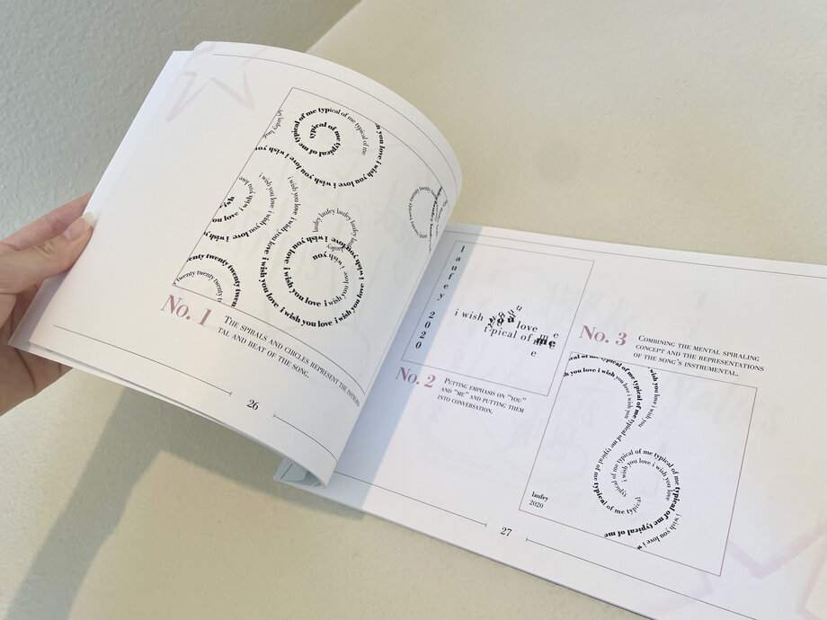 Open songbook showing swirl illustration spreads